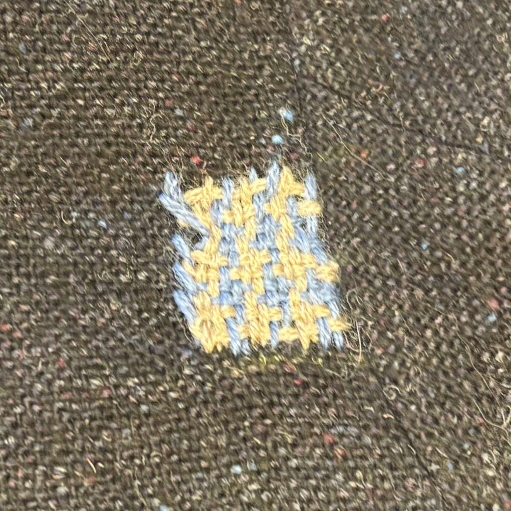 A mini-houndstooth patch in greige and wedgewood blue